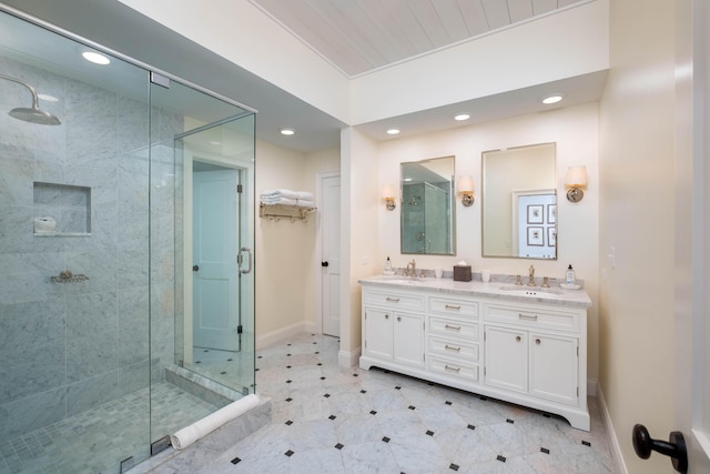 bathroom featuring vanity and an enclosed shower