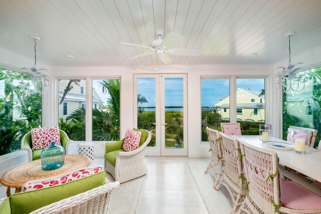 sunroom featuring a wealth of natural light, wooden ceiling, french doors, and ceiling fan