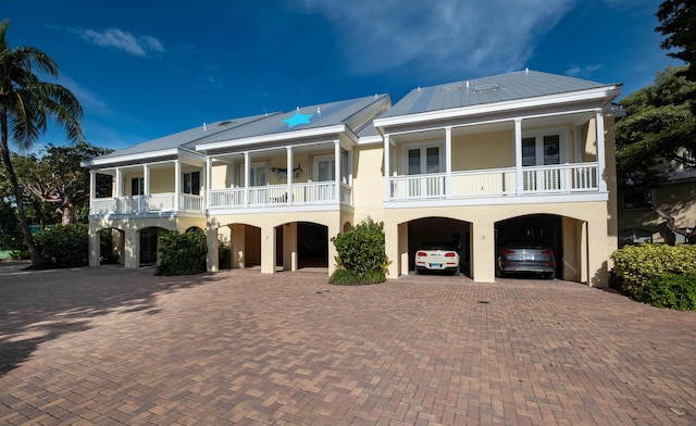 view of front of property featuring a balcony and covered porch