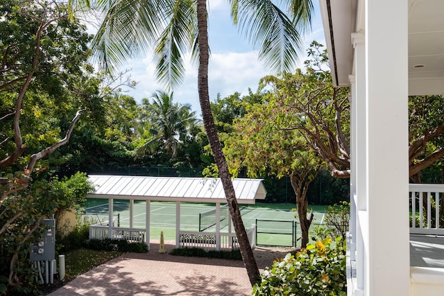 exterior space featuring tennis court