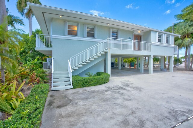 beach home featuring a carport