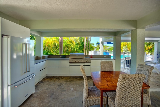 view of patio / terrace featuring grilling area and an outdoor kitchen