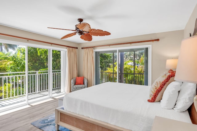 bedroom featuring hardwood / wood-style floors, access to outside, and ceiling fan