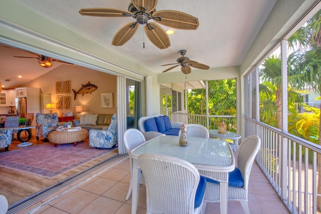 sunroom with vaulted ceiling and ceiling fan