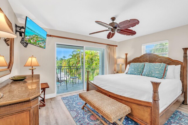 bedroom with multiple windows, access to outside, ceiling fan, and light wood-type flooring