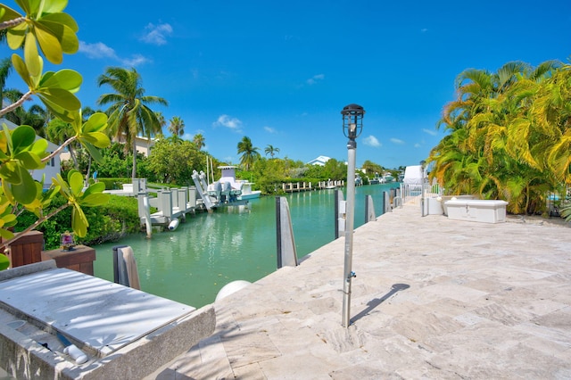 exterior space featuring a water view and a dock