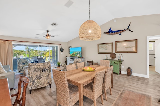 dining area featuring ceiling fan, lofted ceiling, and light hardwood / wood-style floors