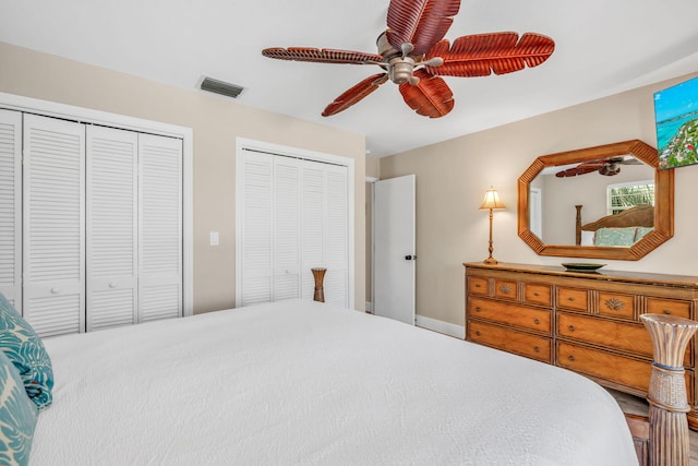 bedroom featuring multiple closets and ceiling fan