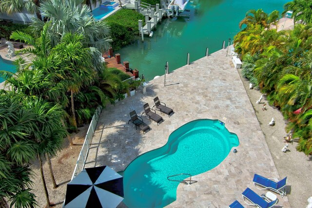 view of pool featuring a water view