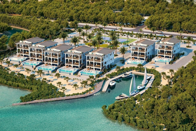 birds eye view of property with a water view