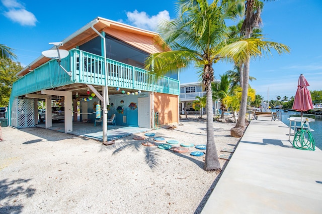 rear view of property featuring a patio area