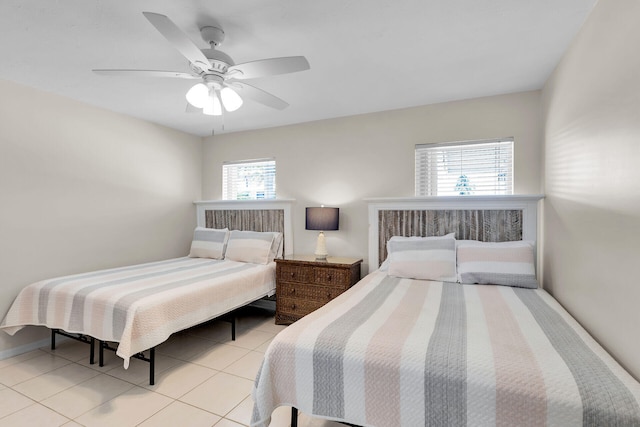 bedroom with light tile patterned flooring and ceiling fan