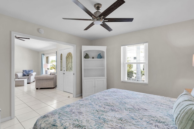 tiled bedroom with ceiling fan