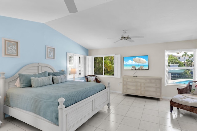 bedroom featuring lofted ceiling, light tile patterned floors, and ceiling fan