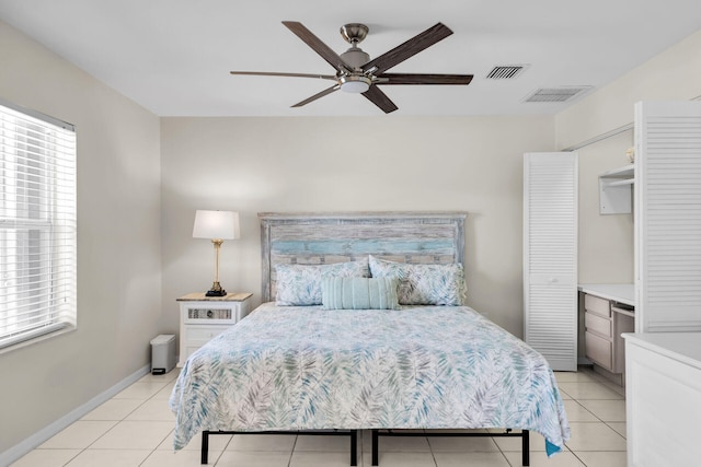 tiled bedroom with ceiling fan