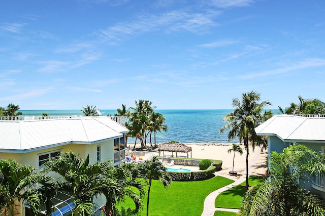 water view with a gazebo and a beach view