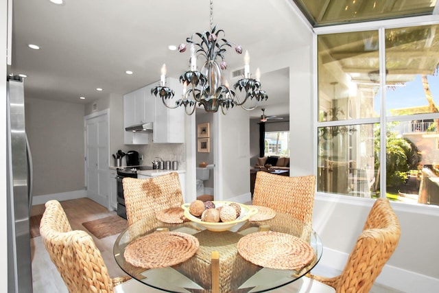 dining space featuring a chandelier