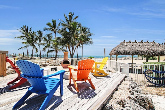 wooden terrace with a gazebo and a water view