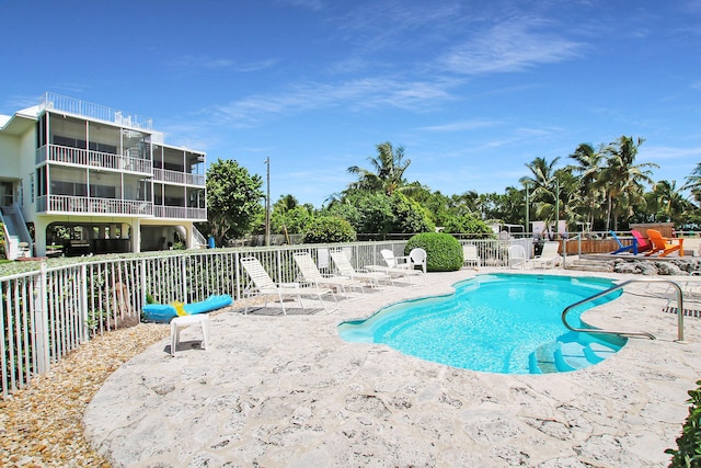 view of swimming pool featuring a patio