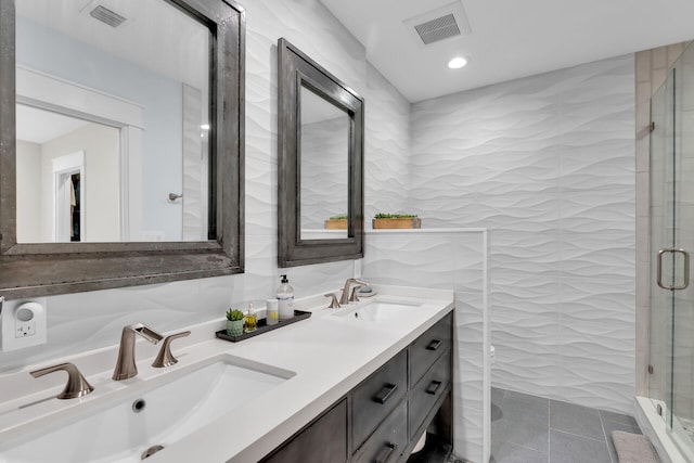 122 S Bay Harbor Dr, Key Largo, FL 33037 - bathroom featuring a shower stall, double vanity, tile patterned floors, and recessed lighting