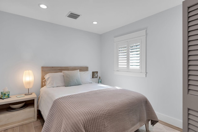 122 S Bay Harbor Dr, Key Largo, FL 33037 - bedroom with recessed lighting, baseboards, and light wood-type flooring