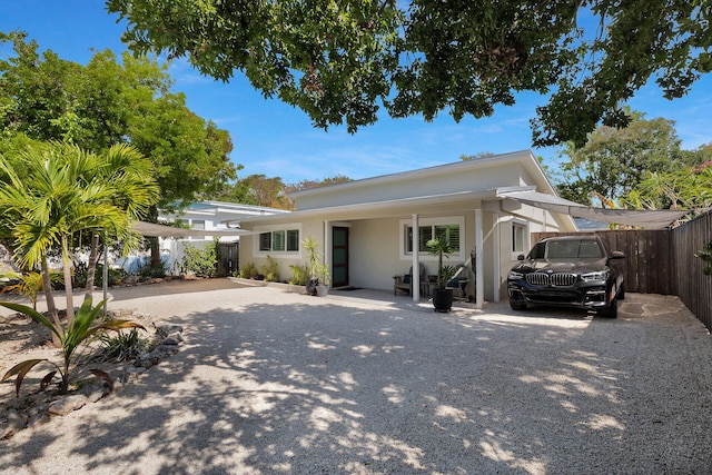 122 S Bay Harbor Dr, Key Largo, FL 33037 - view of front of property featuring fence and stucco siding