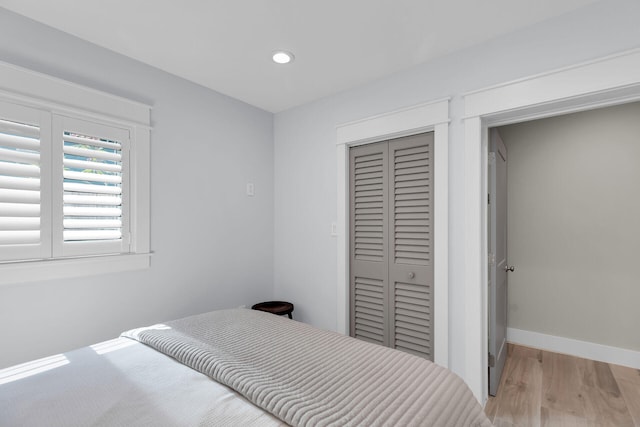 122 S Bay Harbor Dr, Key Largo, FL 33037 - bedroom with a closet, wood finished floors, recessed lighting, and baseboards