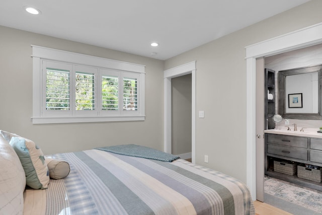 122 S Bay Harbor Dr, Key Largo, FL 33037 - bedroom with recessed lighting and wood finished floors