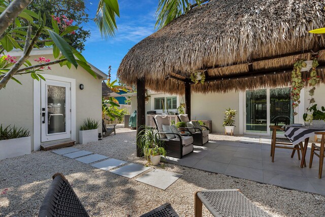 122 S Bay Harbor Dr, Key Largo, FL 33037 - view of patio / terrace featuring a gazebo and an outdoor hangout area