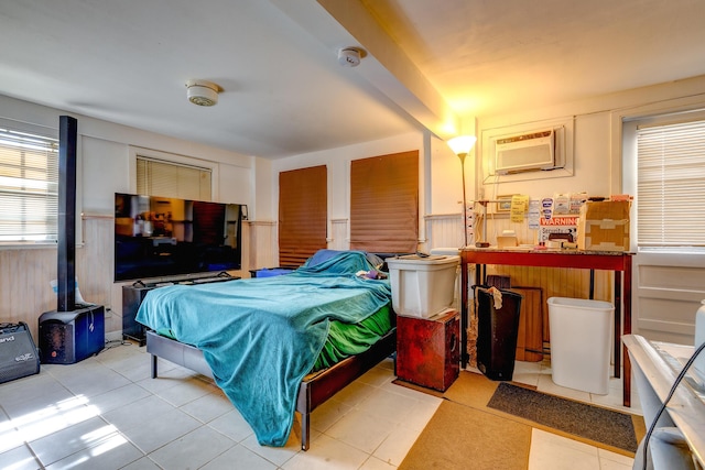 bedroom featuring a wall unit AC