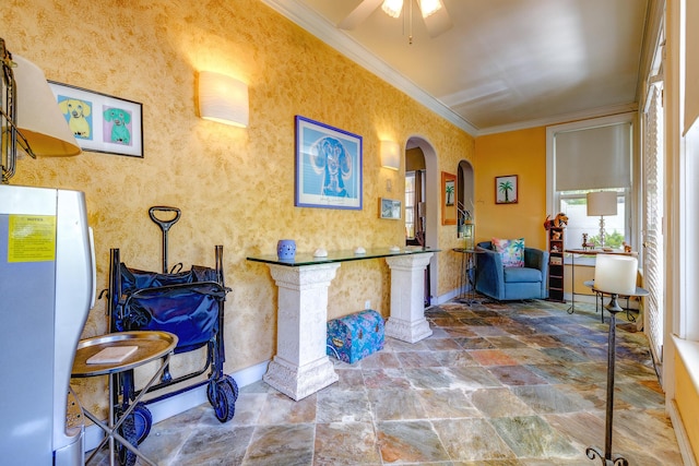 interior space featuring crown molding and ceiling fan