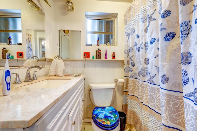 bathroom with vanity, toilet, and a shower with shower curtain