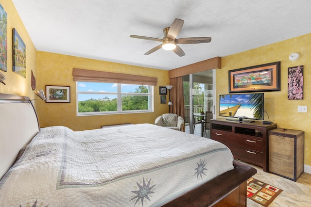 bedroom featuring access to outside and ceiling fan