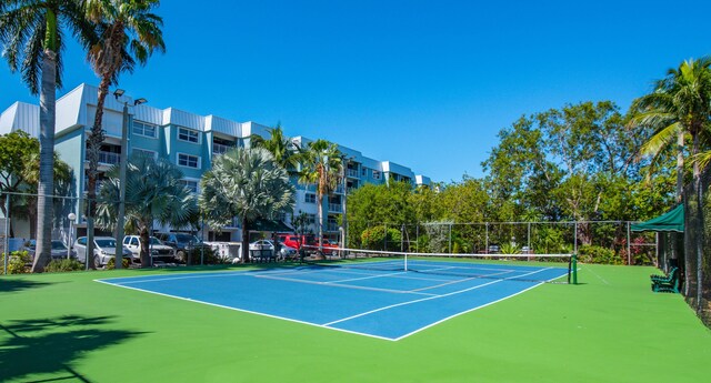 view of tennis court with basketball court