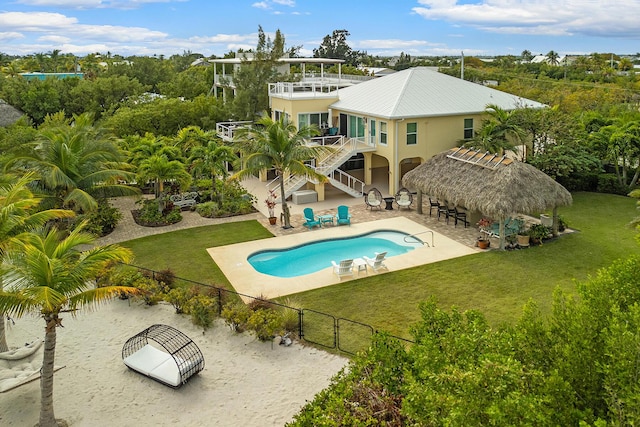 view of swimming pool featuring a patio area and a lawn