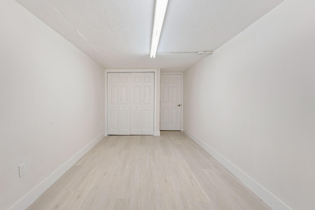 82260 Overseas Hwy, Islamorada, FL 33036 - unfurnished bedroom featuring light wood finished floors and a closet
