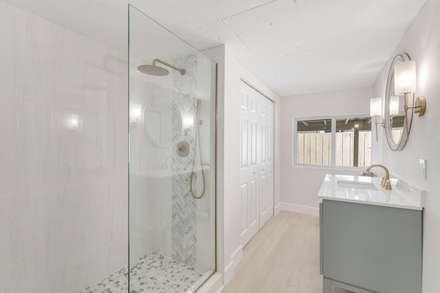 82260 Overseas Hwy, Islamorada, FL 33036 - full bathroom with a shower stall, double vanity, and wood finished floors