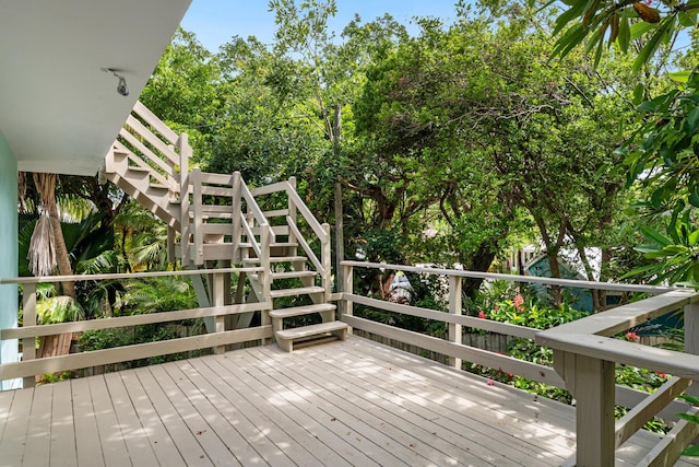 82260 Overseas Hwy, Islamorada, FL 33036 - wooden deck featuring stairs and view of wooded area