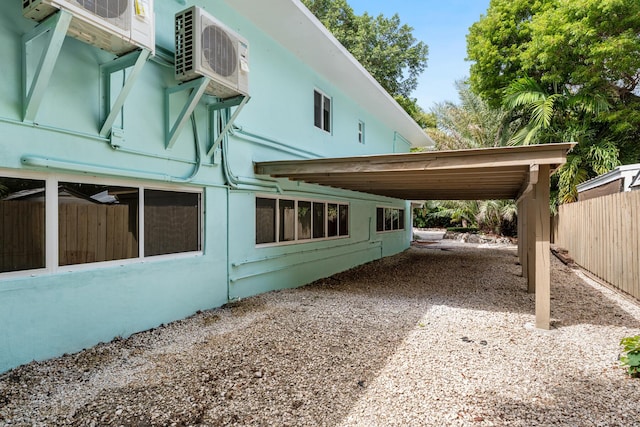 82260 Overseas Hwy, Islamorada, FL 33036 - view of home's exterior featuring a cooling unit and driveway