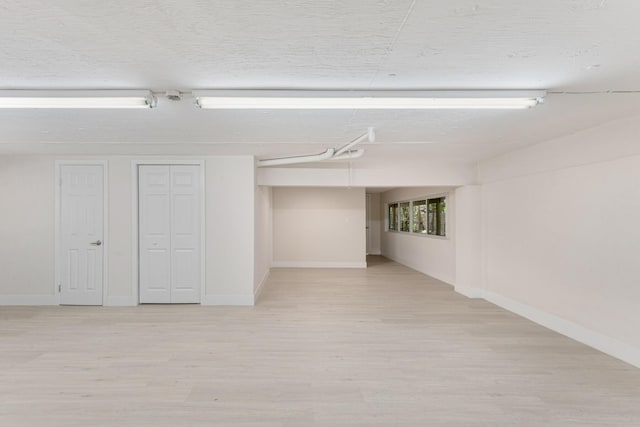 82260 Overseas Hwy, Islamorada, FL 33036 - below grade area with light wood-style floors and baseboards
