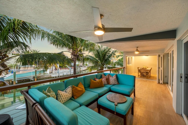 interior space with ceiling fan and an outdoor living space