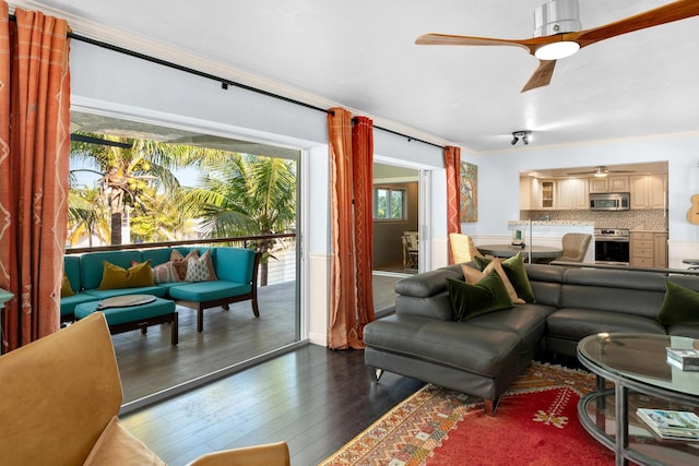 living room featuring dark hardwood / wood-style flooring and ceiling fan