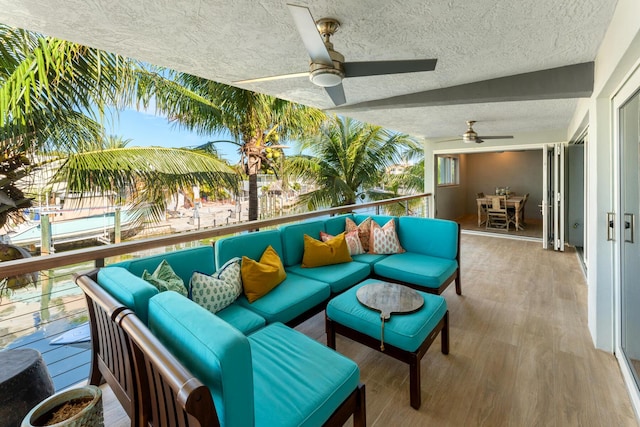 view of patio / terrace featuring an outdoor living space and ceiling fan