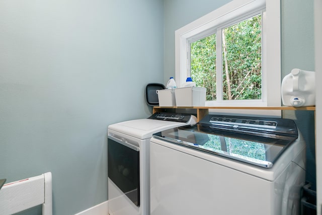 clothes washing area featuring laundry area and independent washer and dryer