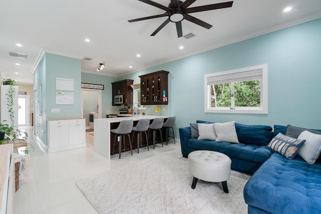 living room with recessed lighting, visible vents, and plenty of natural light