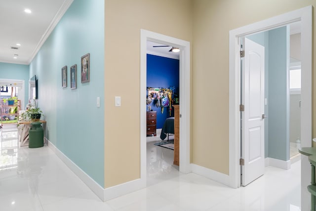 hallway featuring visible vents, recessed lighting, baseboards, and ornamental molding