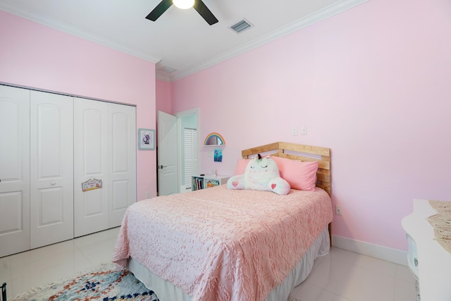 bedroom featuring baseboards, visible vents, a closet, crown molding, and tile patterned floors