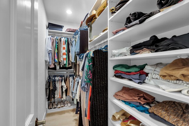 spacious closet featuring light wood-type flooring