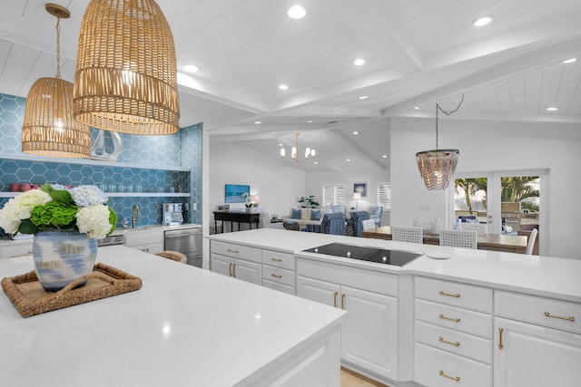 kitchen featuring black electric cooktop, white cabinetry, tasteful backsplash, and lofted ceiling with beams