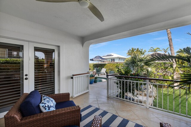 balcony featuring a patio, ceiling fan, and french doors